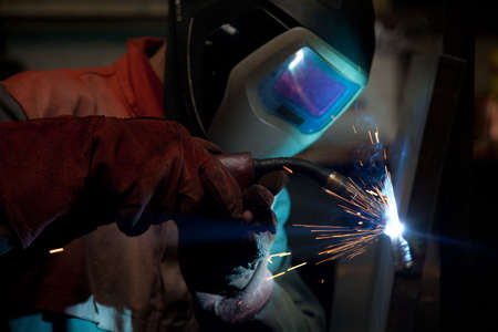Factory welder doing his job