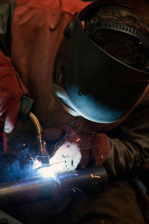 Factory welder doing his job