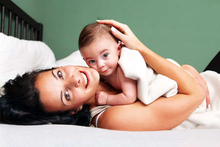 Portrait of happy woman with her baby