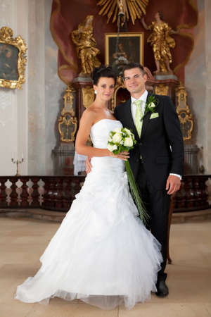 Wedding - young couple just married inside of churchの写真素材