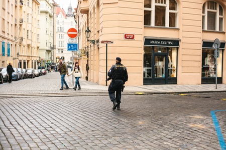 Prague, Czech Republic - December 24, 2016: The police presence at Christmas on the squares. Police patrolled the streets of the city. Strengthening of security measures during public holidays.のeditorial素材