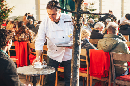 Munich, Germany, December 29, 2016: Popular among the local population and tourists is the open-air restaurant on the Odeonsplatz in Munich. The winter vacation. Outdoor leisure. Daily life in Europe.のeditorial素材