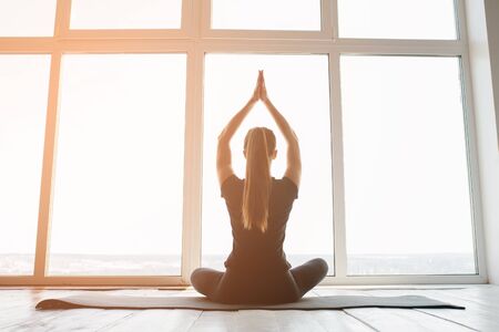 Young beautiful woman practicing yoga and gymnastic. Wellness. Classes in single sports.の写真素材