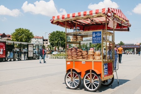 Istanbul, June 11, 2017: Sale of a traditional Turkish bagel called Simit on the square next to the...