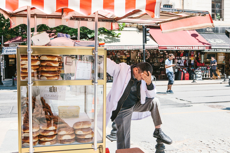 Istanbul, June 15 2017: Stressed out and upset street bakery product vendor having bad headacheのeditorial素材