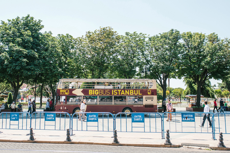 Istanbul, June 15, 2017: Tourist sightseeing bus picking up passengers at the stop at Sultanahmet squareのeditorial素材
