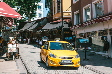 Istanbul, June 15, 2017: Yellow taxi cab in the shopping districtのeditorial素材
