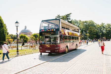 Istanbul, June 16, 2017: Tourist sightseeing bus picking up passengers at the stop at Sultanahmet squareのeditorial素材