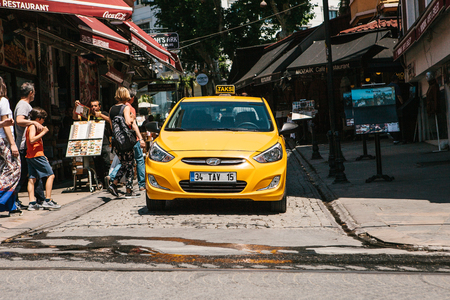 Istanbul, June 16, 2017: Yellow taxi cab in the shopping districtのeditorial素材