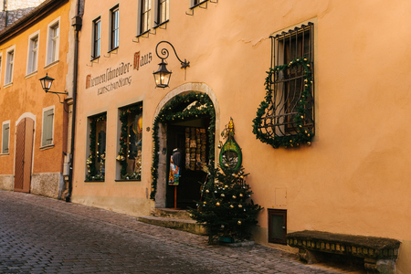 Rothenburg ob der Tauber, Germany, December 30, 2016: A street with decorated shops during the Christmas holidays. Christmas in Europe.のeditorial素材
