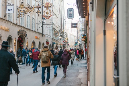 Austria, Salzburg, January 1, 2017: Getreidegasse street. A picturesque street on the territory of the old city, long considered to be the center of trade of Salzburg. Christmas holidays in Europe.のeditorial素材