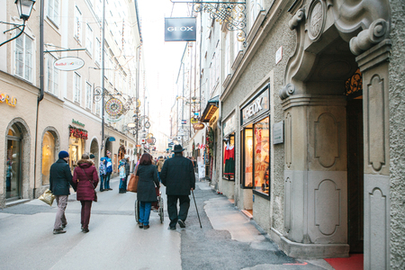 Austria, Salzburg, January 1, 2017: Getreidegasse street. A picturesque street on the territory of the old city, long considered to be the center of trade of Salzburg. Christmas holidays in Europe.のeditorial素材