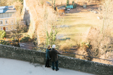 Austria, Salzburg, January 01, 2017: Tourists on a high point look at the city. Travel, vacation, tourism, attractions.のeditorial素材