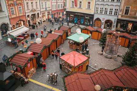 Prague, December 13, 2016: Old Town Square in Prague on Christmas Day. Christmas market in the main square of the city. Happy local residents and tourists walk and rest. Holidays.のeditorial素材