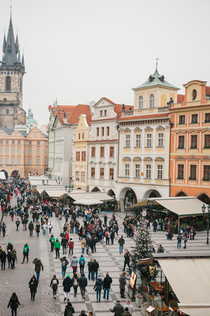 Prague, December 13, 2016: Old Town Square in Prague on Christmas Day. Christmas market in the main square of the city. Happy local residents and tourists walk and rest. Holidays.のeditorial素材