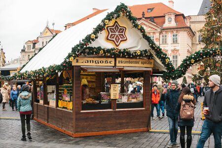 Prague, December 24, 2016: Old Town Square in Prague on Christmas Day. Christmas market in the main square of the city. Happy local residents and tourists walk and rest. Holidays.のeditorial素材