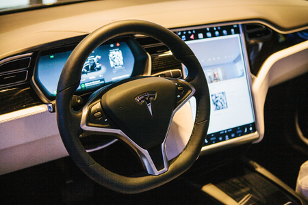 Interior of an electric car Tesla model X. Rudder with the brand name Tesla.のeditorial素材
