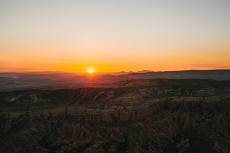 Beautiful view of the hills of Cappadocia. One of the sights of Turkey. Tourism, travel, beautiful landscapes, nature. Morning sunrise. Awesome landscape.の写真素材