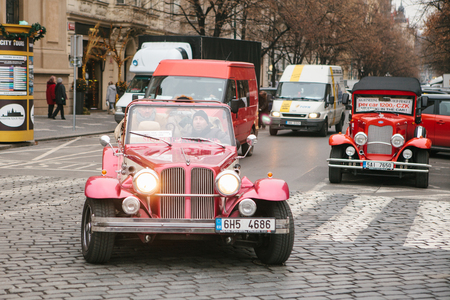 Prague, Czech Republic, December 24, 2016: Retro cars are next to the main square of the city for the entertainment of tourists during the Christmas holidays.のeditorial素材