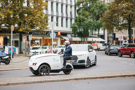Berlin, October 2, 2017: Postal delivery on eco friendly transport Urban Cargo in Germanyのeditorial素材