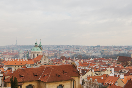 Typical roofs in Prague. Top view - roofs with red tiles in old buildings in Prague. Europe.の写真素材