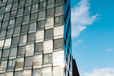 View of the beautiful modern futuristic building. Business concept of successful industrial...