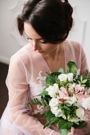 Young woman in a beautiful boudoir. Morning of the bride.の写真素材