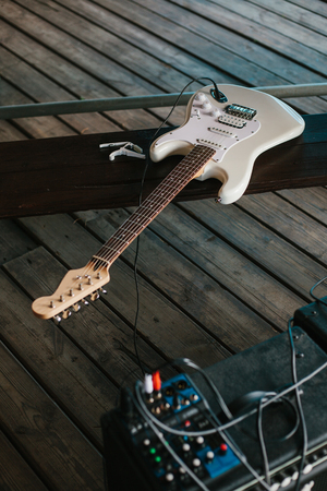 Electric guitar on a wooden surface.