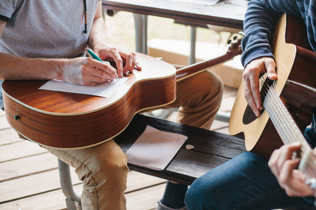 Learning to play the guitar. Music education.の写真素材