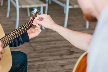 Learning to play the guitar. Music education.の写真素材