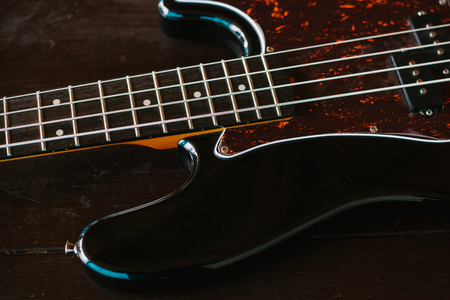 Electric guitar on a wooden surface.の写真素材