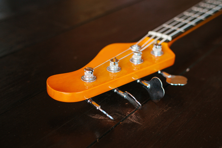 Electric guitar on a wooden surface.の写真素材