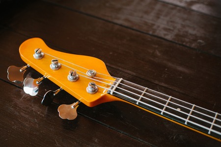 Electric guitar on a wooden surface.の写真素材