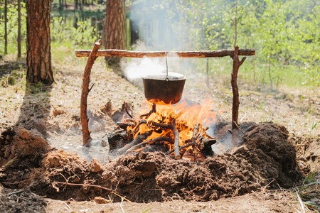 The fire near the camp. Cooking food on a fire. Journey.の写真素材