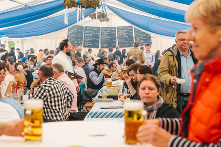 Prague, September 23, 2017: Celebrating the traditional German beer festival called Oktoberfest in the Czech Republic. People communicate with each other and drink fresh German beer.のeditorial素材