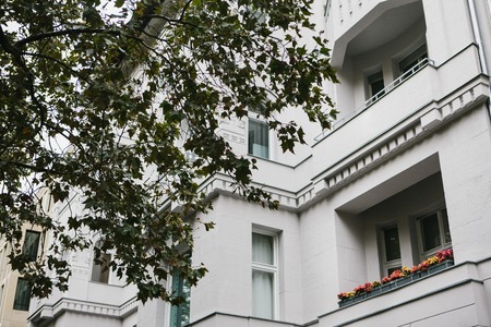 A typical apartment building in Berlin with balconies. Exterior of a multifamily urban houseの写真素材