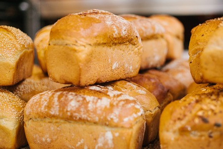 Fresh bread from cereals with seeds from a bakery. Healthy and nutritious food.の写真素材
