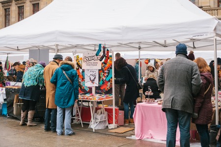 Prague, December 18, 2017: People shoppers walk around the annual popular Christmas designer street market called the Designer Market and are looking for handmade gifts.のeditorial素材