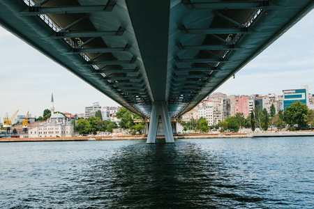 Symmetrically. The lower part of the bridge in Istanbul connects the Asian part with the European part of the city. Architecture of Istanbul in the backgroundの写真素材