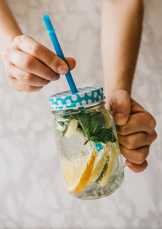 Homemade citrus lemonade or juice or mojito in a jar. Drink from citrus.の写真素材