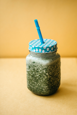 Vegetarian green mix of vegetable and fruit cocktail from cucumber and green parsley and dillの写真素材