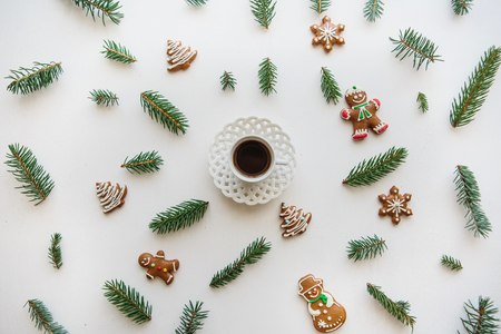A cup of espresso or black tea on a white surface decorated in Christmas or New Years style. Celebratory concept.の写真素材