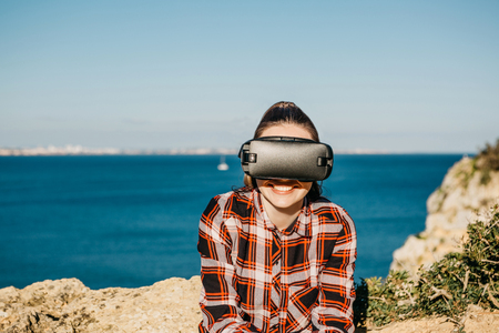 The girl in glasses of a virtual reality. Modern technology in everyday life.