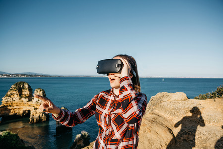 The girl in glasses of a virtual reality. Modern technology in everyday life.の写真素材