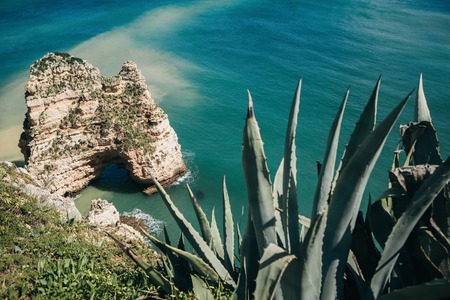 Beautiful views of the Atlantic Ocean and the rocks off the coast of Portugal next to the city called Lagos. Amazing natural landscape.の写真素材