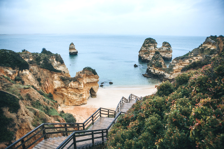 A staircase leading to the beach near the city of Lagos in Portugal.の写真素材
