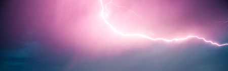 Panoramic view. A flash of lightning in a dramatic sky. A natural phenomenon.の写真素材
