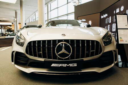 Berlin, August 29, 2018. A close-up of the new white Mercedes-Benz AMG GT is sold in the official Mercedes-Benz dealership in Berlin.のeditorial素材