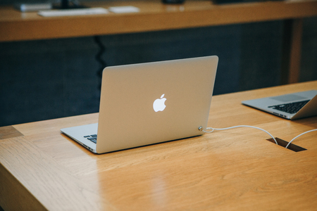 Berlin, August 29, 2018: Retail sale of new MacBooks in the official store of Apple in Berlin. Modern and stylish laptops.のeditorial素材