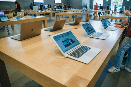 Berlin, August 29, 2018: Retail sale of new MacBooks in the official store of Apple in Berlin. Modern and stylish laptops.のeditorial素材